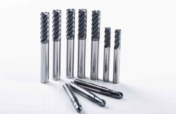 Tungsten carbide milling cutters, also known as cemented carbide or tungsten-cobalt alloy tools, are widely used in various machining applications due to their exceptional hardness and durability. These tools are primarily employed in CNC machining centers and CNC engraving machines, and they can also be used on conventional milling machines to process hard materials that have undergone simple heat treatment. With a hardness of up to 10K Vickers, second only to diamond, tungsten carbide milling cutters are well-suited for high-speed machining. Their high hardness endows them with excellent wear resistance, although they are also characterized by brittleness. To enhance the service life of tungsten carbide milling cutters, several key factors should be considered: - **Optimizing Cutting Parameters**: Selecting appropriate cutting speeds, feed rates, and depths of cut is crucial. Properly chosen cutting parameters can significantly reduce tool wear and extend the life of the cutter. - **Adjusting Tool Geometry**: Modifying the rake angle and the overall shape of the cutter can help to minimize cutting forces and heat generation during machining. This not only improves tool life but also enhances machining efficiency. - **Analyzing and Adjusting Cutting Conditions**: Monitoring and analyzing vibrations during the cutting process is essential. By understanding the cutting state and making timely adjustments, such as altering the cutting parameters or tool setup, potential issues like chatter and excessive wear can be mitigated. - **Selecting Suitable Tool Materials**: Different workpiece materials and machining conditions require different types of tungsten carbide tools. Choosing the right tool material based on the specific application can optimize performance and longevity. By focusing on these aspects, the service life of tungsten carbide milling cutters can be effectively extended, leading to improved machining efficiency and reduced tool replacement costs.